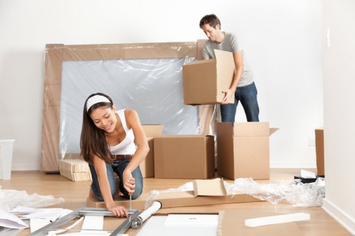Van moving team preparing items safely before transport