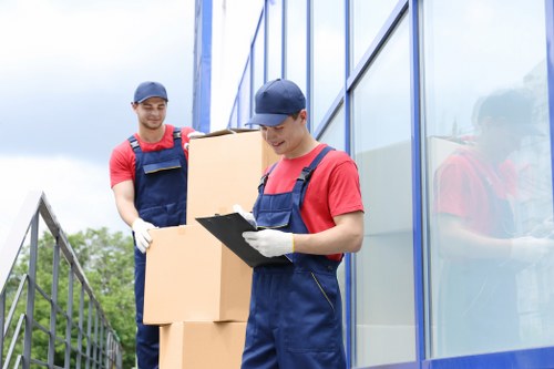 Removal van loading household items from a local property