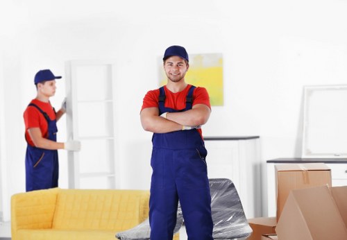 Removal team handling furniture and boxes for a Tulse Hill home move