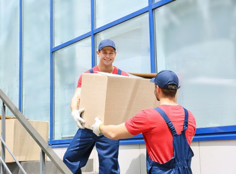 Furniture and boxes prepared for transport by a removals van
