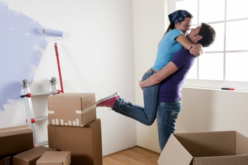 Local movers handling furniture on a residential street in Tulse Hill