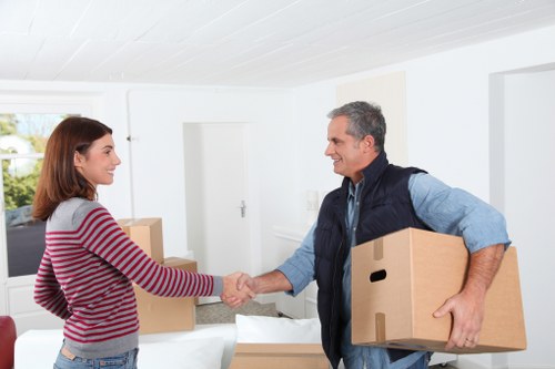 Moving team handling furniture during a van service