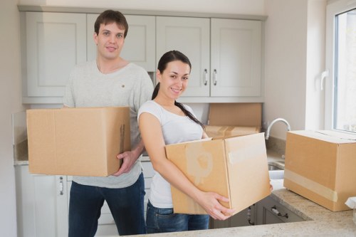 Local movers handling boxes and furniture in South London